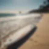 Cabrinha Double Agent surfboard on a beach backdrop