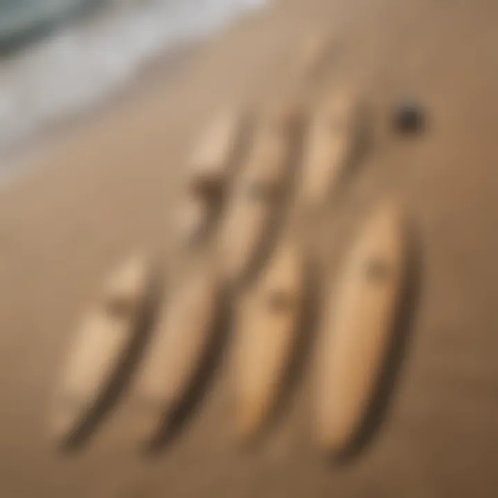 Various sizes of cardboard surfboard cutouts arranged creatively on a beach.