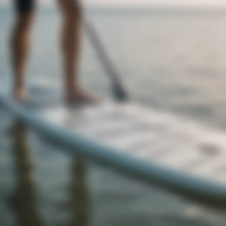 A person measuring a paddleboard