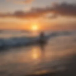 A stunning sunset over Cocoa Beach with surfers in the water