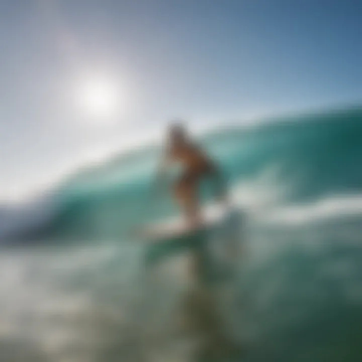 A beginner surfer practicing balance on a surfboard in the water