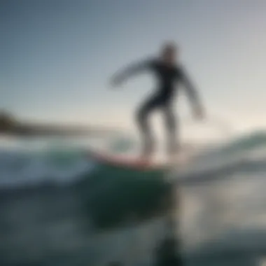 Surfer experiencing the thrill of riding a hydrofoil surfboard over waves