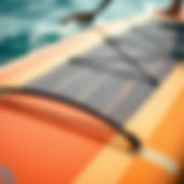 Close-up of paddleboard specifications comparing length and performance