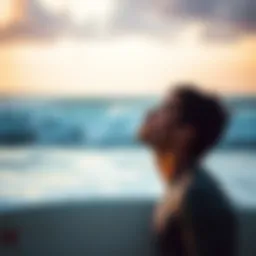 A surfer practicing deep breathing exercises on the beach