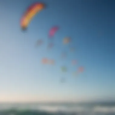 An assortment of kitesurfing kites in vibrant colors against a clear sky