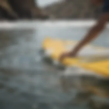 Detailed view of the paddling technique on a smooth surface