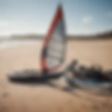 Essential Equipment for Light Wind Kiteboarding A close-up of specialized light wind kiteboarding gear laid out on the beach