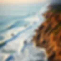 Aerial view of Malibu coastline with surfers in the water