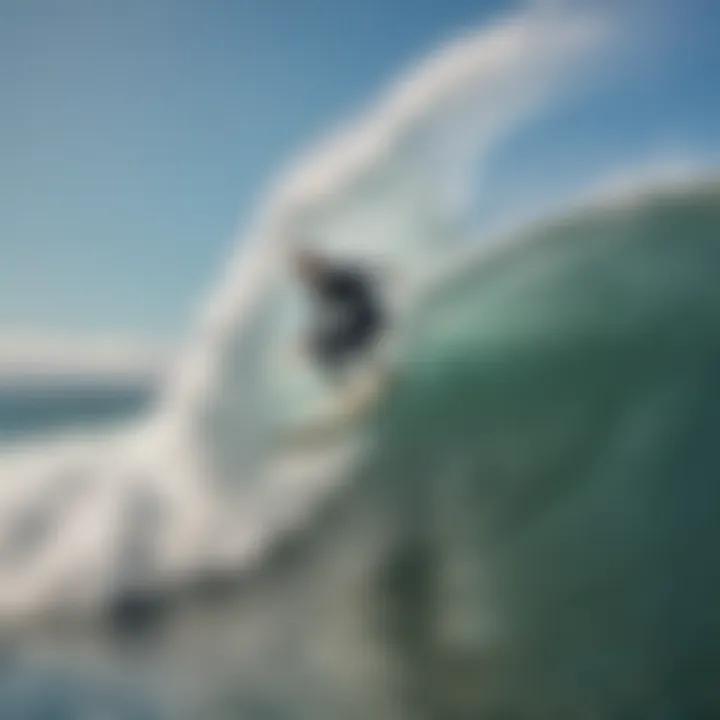 An aerial shot of a surfer gracefully riding a wave, showcasing the dynamic surf culture in Santa Cruz.