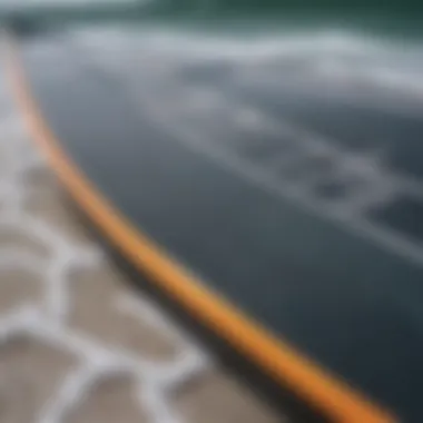 Close-up of a shortboard showcasing its sleek design and fin setup