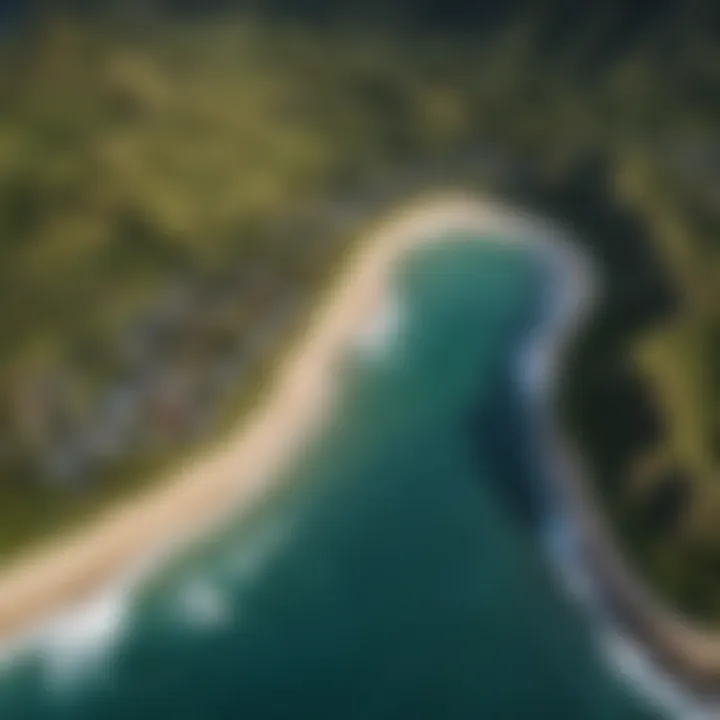 Aerial shot of the unique geographical features of Hanalei Bay, highlighting its perfect surf conditions.