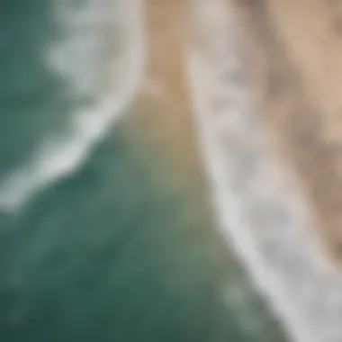 Aerial view of a popular surf beach packed with surfers and beachgoers