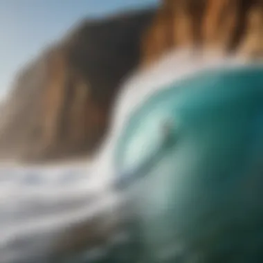 A surfer catching a wave with scenic cliffs in the background