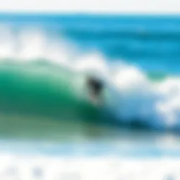 A surfer catching a wave at La Jolla Shores