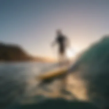 Serene Sunset SUP Surfing Experience A serene sunset backdrop with an inflatable SUP surfer enjoying the waves