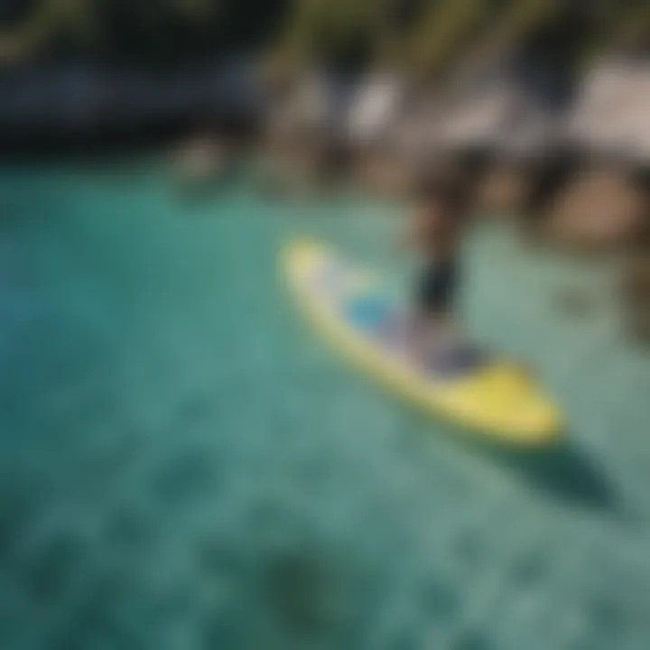 A vibrant inflatable SUP board gliding over crystal clear waters