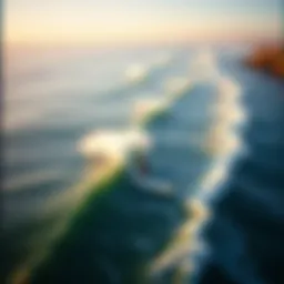 Aerial view of surfers catching waves at a popular surf spot during golden hour