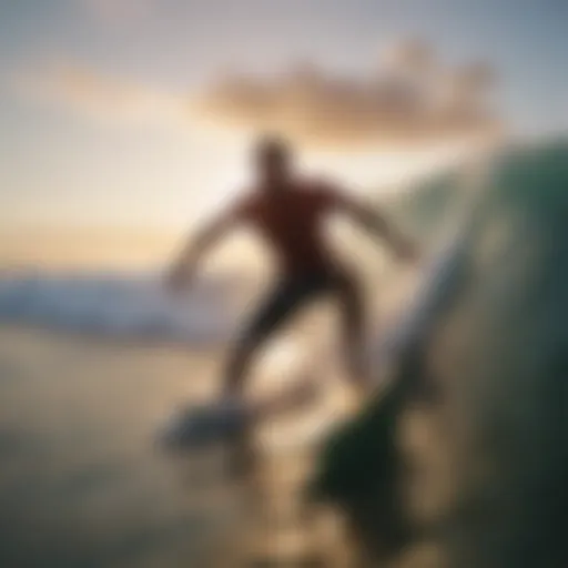 Surfer catching a wave at sunrise