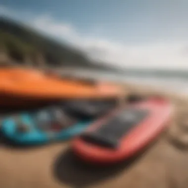 Close-up of essential bodyboarding gear laid out on the beach