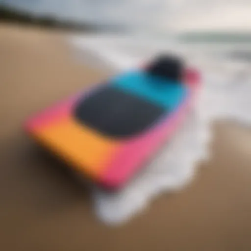 A vibrant foam bodyboard resting on the sand, showcasing its sleek design.