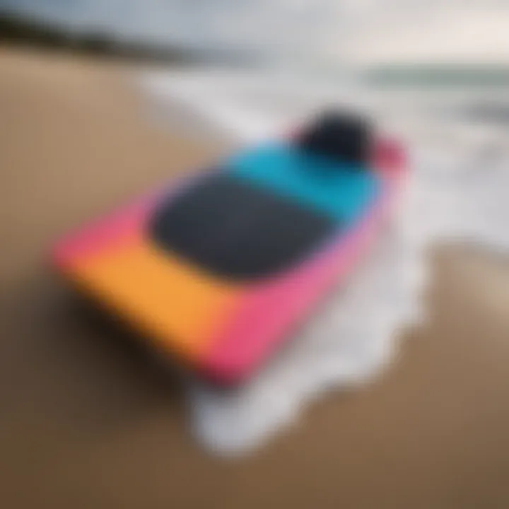 A vibrant foam bodyboard resting on the sand, showcasing its sleek design.