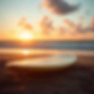 A vintage longboard resting on the beach at sunset