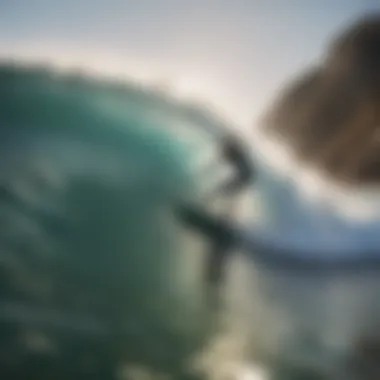 A surfer catching a wave at Windansea Beach