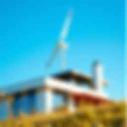 A modern house showcasing a sleek wind turbine on its roof against a blue sky