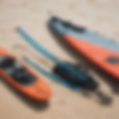 Close-up of kite surfing gear and equipment laid out on the sand