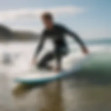 Instructor demonstrating surfing techniques on the beach