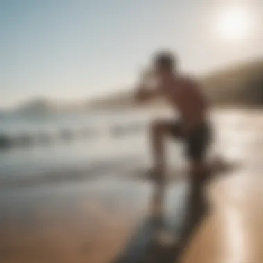 A surfer drinking water on the beach post-session