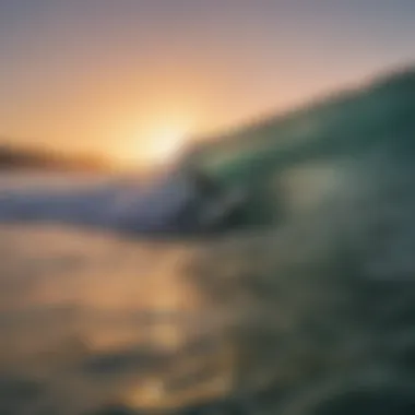 A surfer catching a wave at sunset