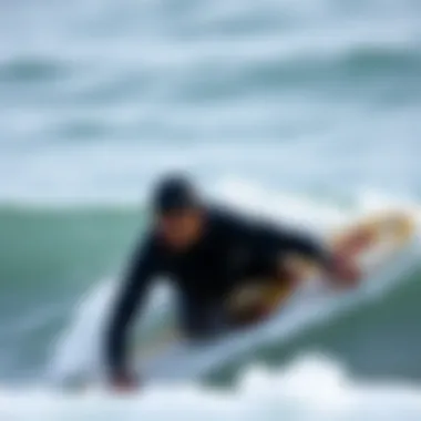 A surfer in action showcasing flexibility in a wetsuit