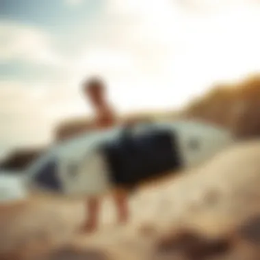 A surfer preparing to travel with a boogie board in a travel bag.