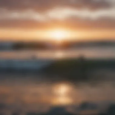 Sunset view over the Atlantic Ocean with surfers