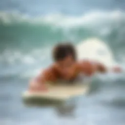 Surfer practicing swimming drills in the ocean