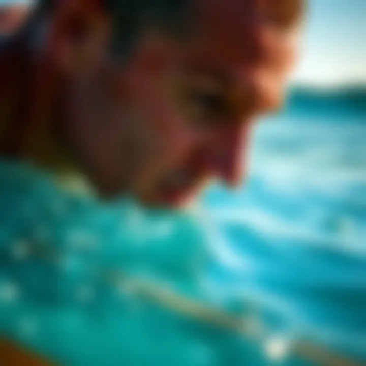Focusing on Swimming Technique for Surfboarders Close-up of a surfboarder focusing on swimming technique