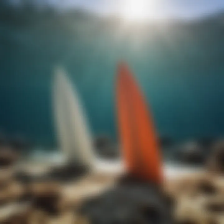 Close-up of surfboard fins interacting with coral reef water