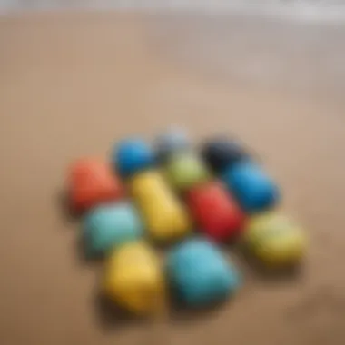 Various sizes of dry bags arranged on a sandy beach