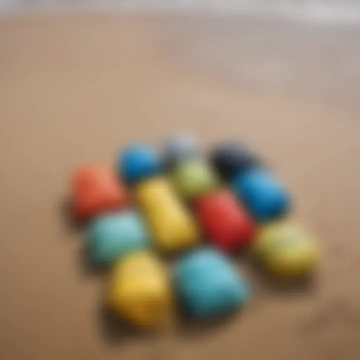 Various sizes of dry bags arranged on a sandy beach