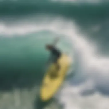 An aerial perspective of a shortboard in action on a wave