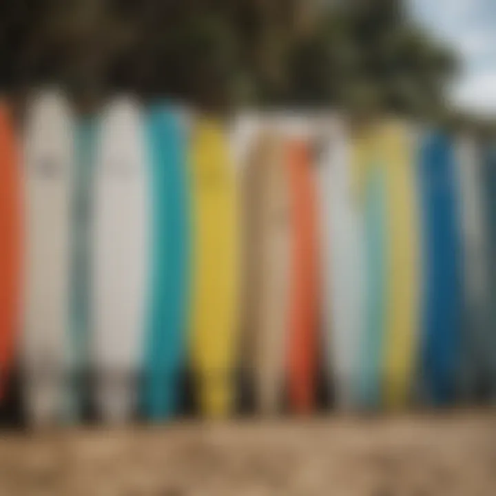 A variety of used foam surfboards displayed on a beach