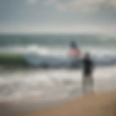 A surfer observing warning flags at a beach with crashing waves.