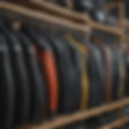 Diverse types of wetsuits displayed on a rack